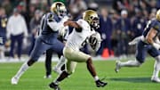 Nov 23, 2024; New York, New York, USA; Army Black Knights running back Kanye Udoh (6) runs with the ball against the Notre Dame Fighting Irish during the first half at Yankee Stadium. 