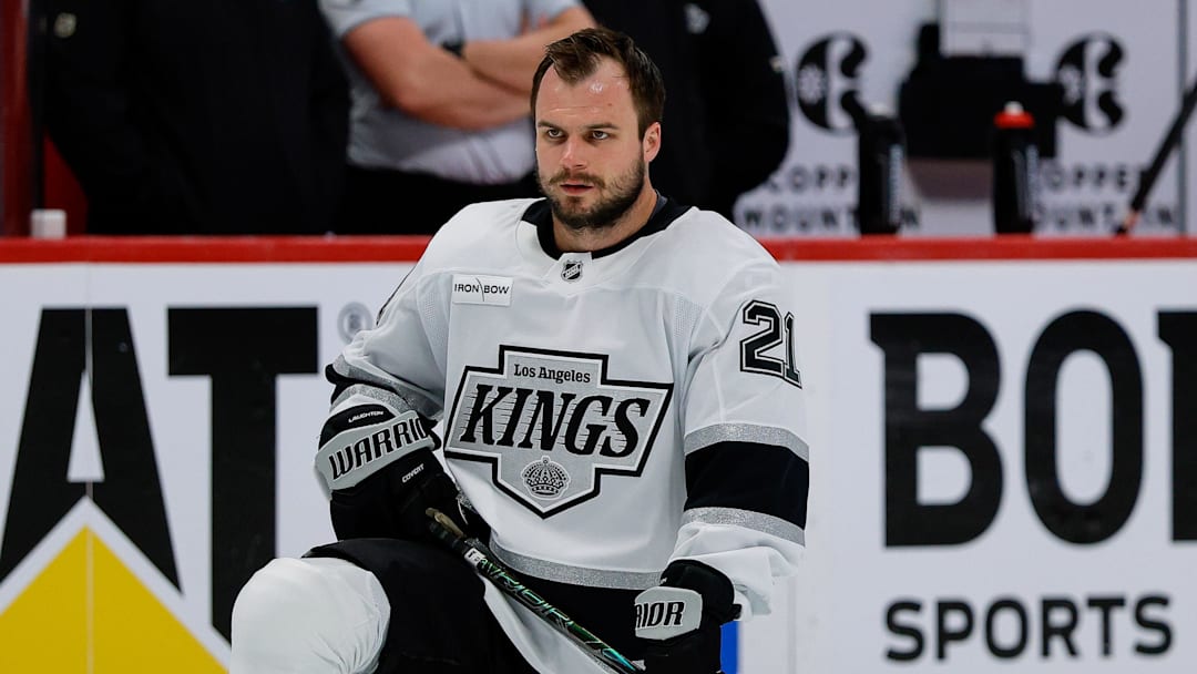 Apr 21, 2026; Denver, Colorado, USA; Los Angeles Kings center Scott Laughton (21) stretches before game two against the Colorado Avalanche of the first round of the 2026 Stanley Cup Playoffs at Ball Arena. Mandatory Credit: 