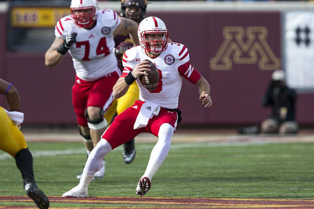Nebraska Cornhuskers quarterback Taylor Martinez (3) scrambles out of the pocket in the second quarter against Minnesota.
