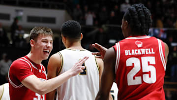 Wisconsin Badgers guard Jack Janicki (33) and Wisconsin Badgers guard John Blackwell (25) celebrate as the final whistle goes Saturday, Feb. 15, 2025, during the NCAA men’s basketball game against the Purdue Boilermakers at Mackey Arena in West Lafayette, Ind. Wisconsin Badgers won 94-84.