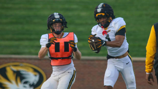 Missouri Tigers safety Marvin Burks (1) intercepts a pass at the team's annual fan night practice at Faurot Field.