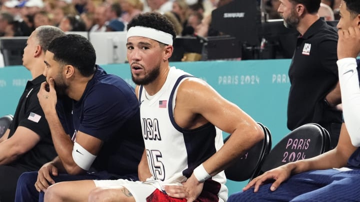 Aug 8, 2024; Paris, France; United States guard Devin Booker (15) looks on from the bench during the first half against Serbia in a men's basketball semifinal game during the Paris 2024 Olympic Summer Games at Accor Arena. Mandatory Credit: Rob Schumacher-USA TODAY Sports