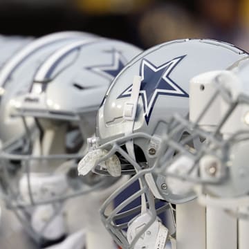 Jan 7, 2024; Landover, Maryland, USA; A view of Dallas Cowboys players' helmets on the bench against the Washington Commanders during the first quarter at FedExField. Mandatory Credit: Geoff Burke-Imagn Images