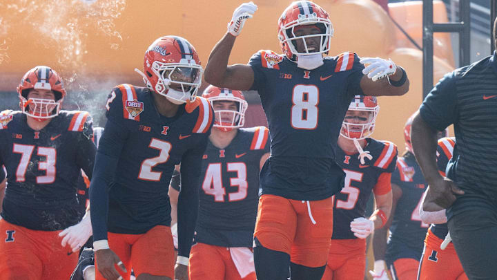 Dec 31, 2024; Orlando, FL, USA; Illinois Fighting Illini wide receiver Malik Elzy (8) and Illinois Fighting Illini wide receiver Ashton Hollins (2) lead the team out of the tunnel before the game against the South Carolina Gamecocks at Camping World Stadium. Mandatory Credit: Jeremy Reper-Imagn Images