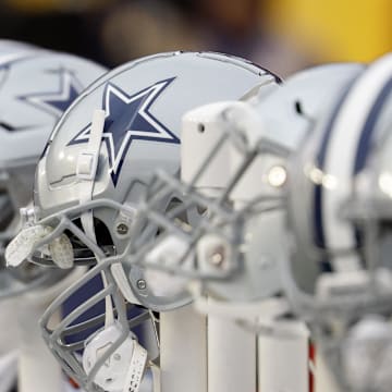  A view of Dallas Cowboys players' helmets on the bench against the Washington Commanders.