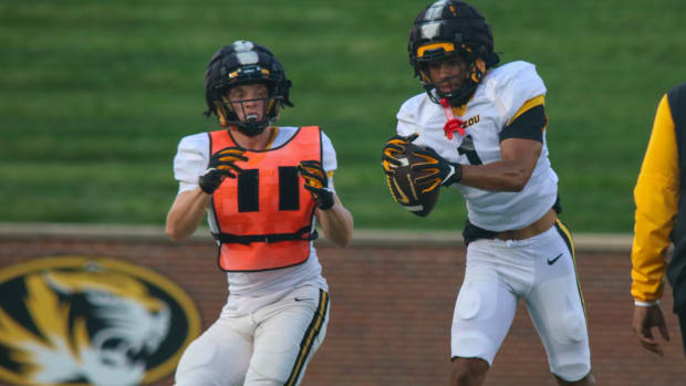 Missouri Tigers safety Marvin Burks (1) intercepts a pass at the team's annual fan night practice at Faurot Field.