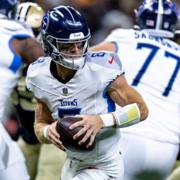 Aug 25, 2024; New Orleans, Louisiana, USA;  Tennessee Titans quarterback Will Levis (8) rolls out the pocket to pass against the New Orleans Saints during the first half at Caesars Superdome. Mandatory Credit: Stephen Lew-USA TODAY Sports