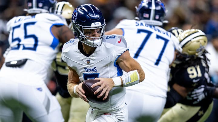 Aug 25, 2024; New Orleans, Louisiana, USA;  Tennessee Titans quarterback Will Levis (8) rolls out the pocket to pass against the New Orleans Saints during the first half at Caesars Superdome. Mandatory Credit: Stephen Lew-USA TODAY Sports