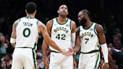 Nov 28, 2023; Boston, Massachusetts, USA; Boston Celtics guard Jaylen Brown (7) with forward Jayson Tatum (0) and center Al Horford (42) after his basket against the Chicago Bulls in the second half at TD Garden. Mandatory Credit: David Butler II-Imagn Images