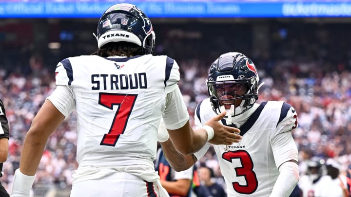 Sep 17, 2023; Houston, Texas, USA; Houston Texans quarterback C.J. Stroud (7) and wide receiver Tank Dell (3) celebrate during the second half against the Indianapolis Colts at NRG Stadium. Mandatory Credit: Maria Lysaker-USA TODAY Sports