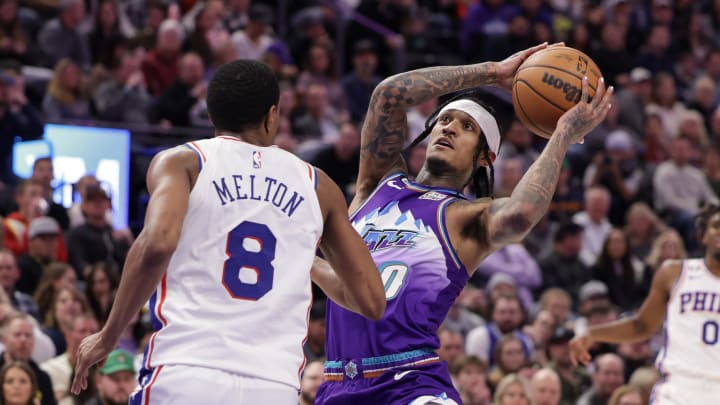 Jan 14, 2023; Salt Lake City, Utah, USA;  Utah Jazz guard Jordan Clarkson (00) tries to get past Philadelphia 76ers guard De'Anthony Melton (8) and to the basket during the second half at Vivint Arena. Mandatory Credit: Chris Nicoll-USA TODAY Sports