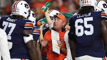 Oct 18, 2025; Auburn, Alabama, USA;  Auburn Tigers head coach Hugh Freeze talks with offensive lineman Jeremiah Wright (77) during the first quarter against the Missouri Tigers at Jordan-Hare Stadium. Mandatory Credit: John Reed-Imagn Images