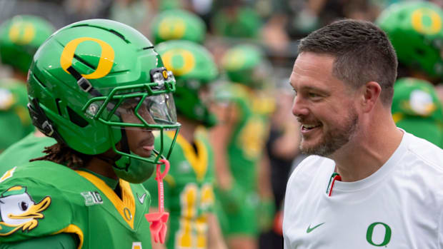 Oregon Ducks Dakorien Moore Jeremiah Smith Ohio State Buckeyes NIL Recruiting Dan Lanning Evan Stewart College Football NIL 