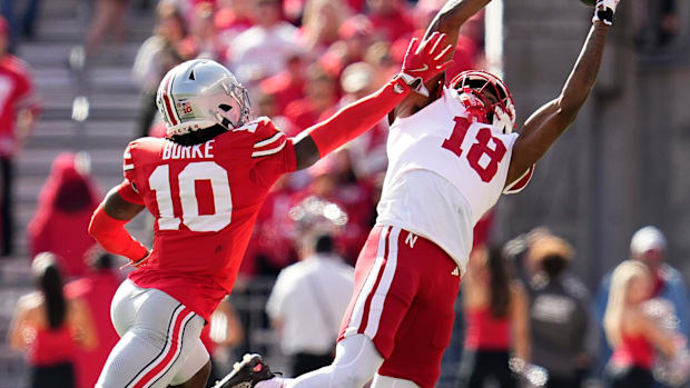 Nebraska Cornhuskers wide receiver Isaiah Neyor attempts a catch behind Ohio State Buckeyes cornerback Denzel Burke. 