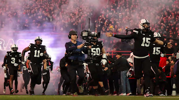 Nebraska quarterback Dylan Raiola leads the team out of the tunnel to face USC.