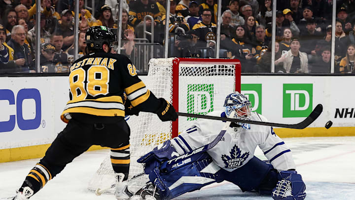 Mar 24, 2026; Boston, Massachusetts, USA; Boston Bruins right wing David Pastrnak (88) reaches for a rebound in front of Toronto Maple Leafs goaltender Anthony Stolarz (41) during the second period at TD Garden. Mandatory Credit: Winslow Townson-Imagn Images