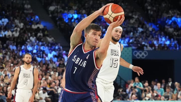 Aug 8, 2024; Paris, France; Serbia shooting guard Bogdan Bogdanovic (7) controls the ball during the first half against the United States in a men's basketball semifinal game during the Paris 2024 Olympic Summer Games at Accor Arena. Mandatory Credit: Rob Schumacher-USA TODAY Sports