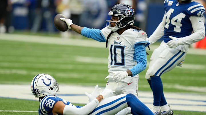 Tennessee Titans wide receiver DeAndre Hopkins (10) getting up from the ground after a catch over defensive back JuJu Brents