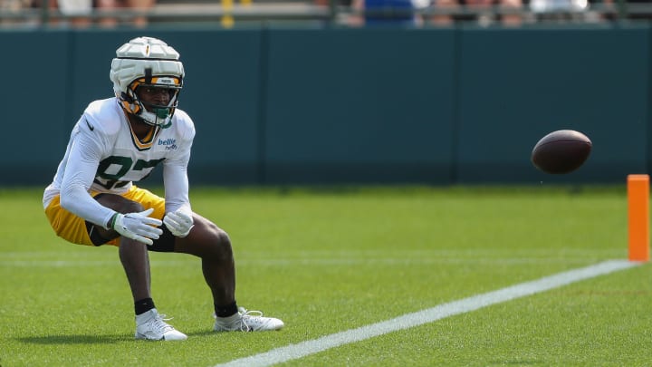 Green Bay Packers wide receiver Romeo Doubs (87) tries to catch a low pass at training camp on July 30.