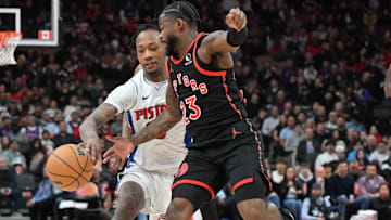 Apr 4, 2025; Toronto, Ontario, CAN;  Toronto Raptors guard Jamal Shead (23) steals the ball from Detroit Pistons forward Ron Holland II (00) : Dan Hamilton-Imagn Images