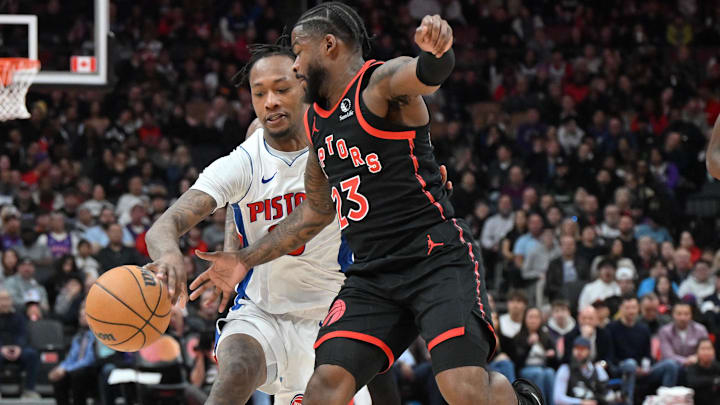 Apr 4, 2025; Toronto, Ontario, CAN;  Toronto Raptors guard Jamal Shead (23) steals the ball from Detroit Pistons forward Ron Holland II (00) : Dan Hamilton-Imagn Images