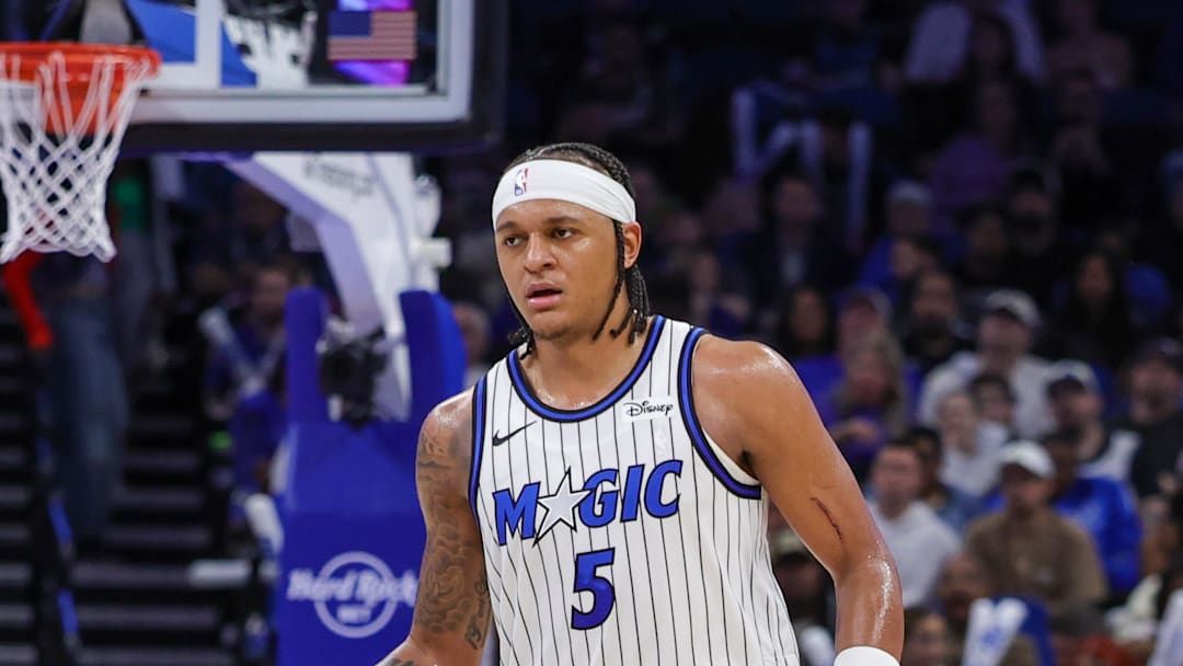Jan 11, 2026; Orlando, Florida, USA; Orlando Magic forward Paolo Banchero (5) brings the ball up court during the second half against the New Orleans Pelicans at Kia Center. Mandatory Credit: Mike Watters-Imagn Images