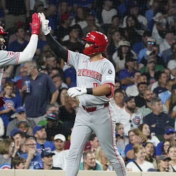 Aug 5, 2025; Chicago, Illinois, USA;  Cincinnati Reds first base Spencer Steer (7) celebrates with outfielder Miguel Andujar (38) after hitting a home run during the seventh inning against the Chicago Cubs at Wrigley Field. Mandatory Credit: David Banks-Imagn Images