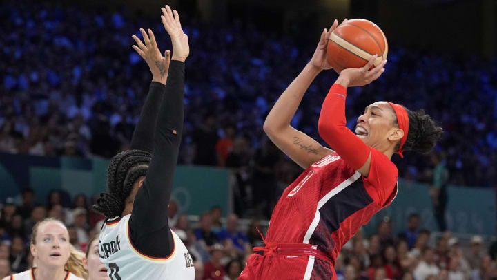 Aug 4, 2024; Villeneuve-d'Ascq, France; United States forward A'Ja Wilson (9) shoots against Germany forward Satou Sabally (0) in the first half in a women’s Group C game during the Paris 2024 Olympic Summer Games at Stade Pierre-Mauroy.