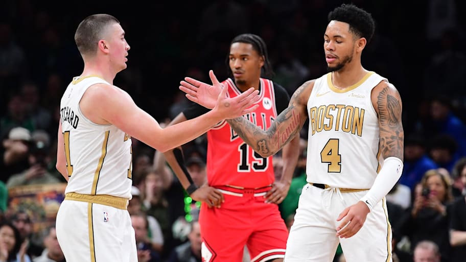 Boston Celtics guard Payton Pritchard congratulates guard Anfernee Simons after a basket against the Chicago Bulls.