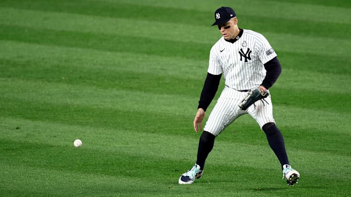 Oct 30, 2024; New York, New York, USA; New York Yankees outfielder Aaron Judge (99) makes a fielding error during the fifth inning against the Los Angeles Dodgers in game five of the 2024 MLB World Series at Yankee Stadium. Mandatory Credit: Wendell Cruz-Imagn Images