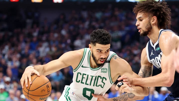 Jun 12, 2024; Dallas, Texas, USA; Boston Celtics forward Jayson Tatum (0) dribbles the ball against Dallas Mavericks center Dereck Lively II (2) during the second quarter during game three of the 2024 NBA Finals at American Airlines Center. Mandatory Credit: Kevin Jairaj-USA TODAY Sports