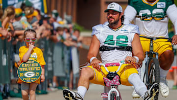 Green Bay Packers long snapper Matt Orzech (42) rides a young fan’s bicycle to practice in the DreamDrive before the eighth practice of training camp on Wednesday, July 31, 2024, at Lambeau Field in Green Bay, Wis.
Tork Mason/USA TODAY NETWORK-Wisconsin