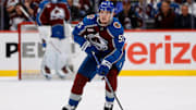 Apr 23, 2025; Denver, Colorado, USA; Colorado Avalanche defenseman Ryan Lindgren (55) controls the puck in the second period against the Dallas Stars in game three of the first round of the 2025 Stanley Cup Playoffs at Ball Arena. Mandatory Credit: Isaiah J. Downing-Imagn Images
