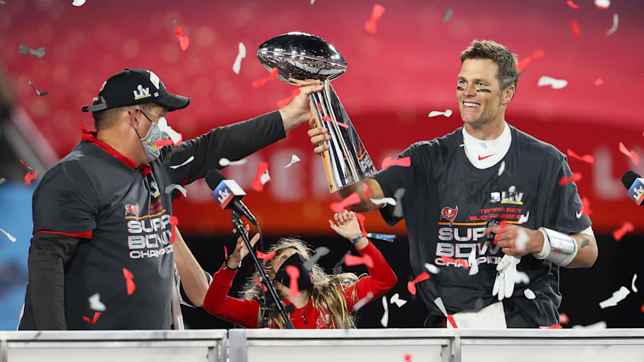 Tampa Bay Buccaneers quarterback Tom Brady hoists the Vince Lombardi Trophy after defeating the Kansas City Chiefs. | Matthew Emmons-Imagn Images