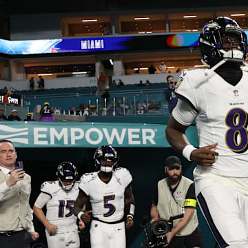 Oct 30, 2025; Miami Gardens, Florida, USA; Baltimore Ravens quarterback Lamar Jackson (8) warms up before a game against the Miami Dolphins at Hard Rock Stadium. Mandatory Credit: Nathan Ray Seebeck-Imagn Images