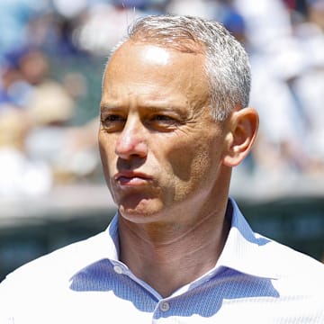 Jul 18, 2025; Chicago, Illinois, USA; Chicago Cubs President of Baseball Operations Jed Hoyer walks on the sidelines before a baseball game between the Chicago Cubs and Boston Red Sox at Wrigley Field. 
