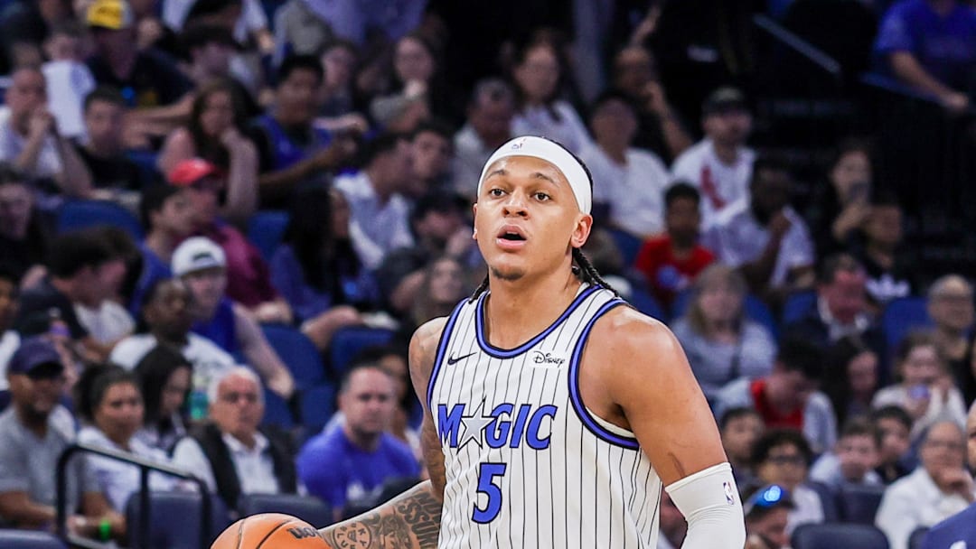 Mar 31, 2026; Orlando, Florida, USA; Orlando Magic forward Paolo Banchero (5) brings the ball up court during the second half against the Phoenix Suns at Kia Center. Mandatory Credit: Mike Watters-Imagn Images