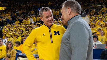 Michigan’s Dusty May greets Michigan State’s Tom Izzo before their rivalry matchup game at Crisler Center in Ann Arbor, on Friday, Feb. 21, 2025.