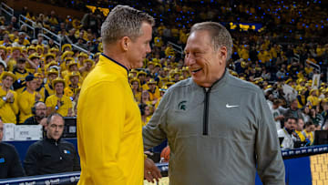 Michigan State’s Tom Izzo smiles as he greets Michigan’s Dusty May before their rivalry matchup game at Crisler Center in Ann Arbor, on Friday, Feb. 21, 2025.