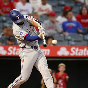 Texas Rangers second baseman Marcus Semien (2) hits a double during the first inning against the Los Angeles Angels at Angel Stadium on Sept 28.