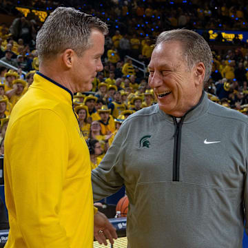 Michigan State’s Tom Izzo smiles as he greets Michigan’s Dusty May before their rivalry matchup game at Crisler Center in Ann Arbor, on Friday, Feb. 21, 2025.
