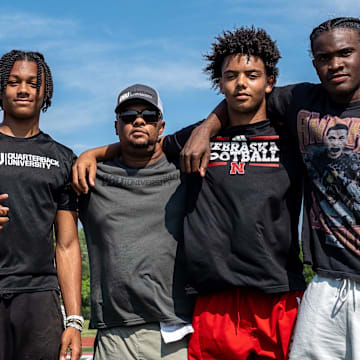 From left to right, Donald Tabron II, 16, Donovan Dooley, 40, owner and founder of Quarterback University, Trae Taylor, 16, and Bryce Underwood, 17