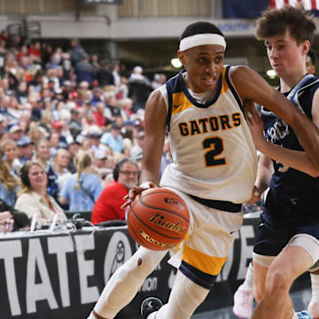 Annie Wright's Jeremiah Harshman drives to the hoop against Lynden Christian during the Class 1A state title game in the Yakima Valley SunDome.