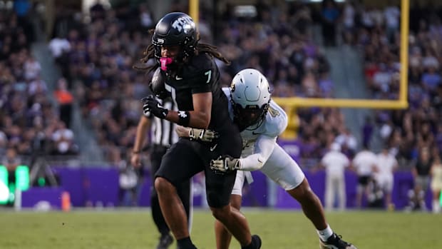 TCU Horned Frogs wide receiver Jordan Dwyer (7) runs after the catch as Colorado Buffaloes defensive back Preston Hodge (
