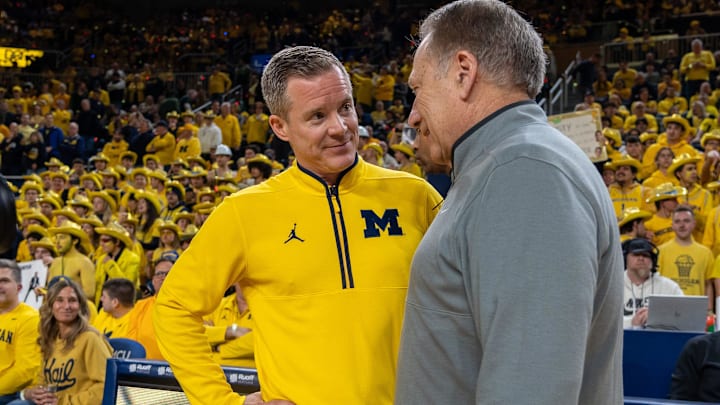 Michigan’s Dusty May greets Michigan State’s Tom Izzo before their rivalry matchup game at Crisler Center in Ann Arbor, on Friday, Feb. 21, 2025.