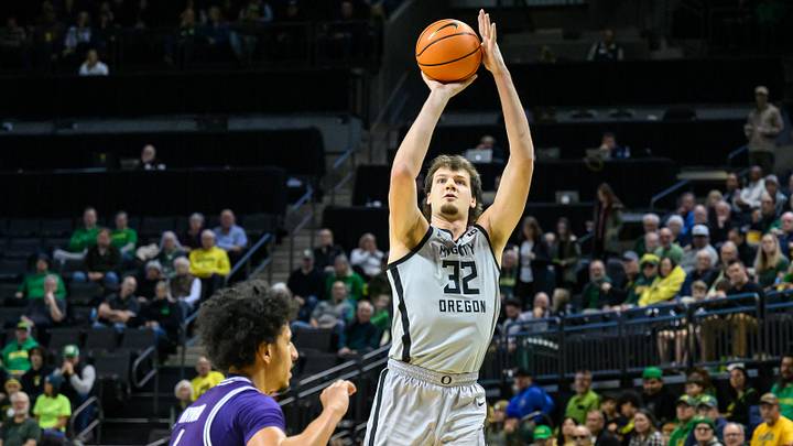 Dec 15, 2024; Eugene, Oregon, USA;  Oregon Ducks center Nate Bittle (32) shoots a jump shot during the first half against the Stephen F. Austin Lumberjacks at Matthew Knight Arena.