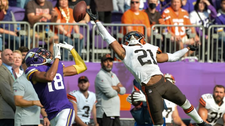 Cleveland Browns cornerback Denzel Ward (21) deflects a pass intended for Minnesota Vikings wide receiver Justin Jefferson (18) 