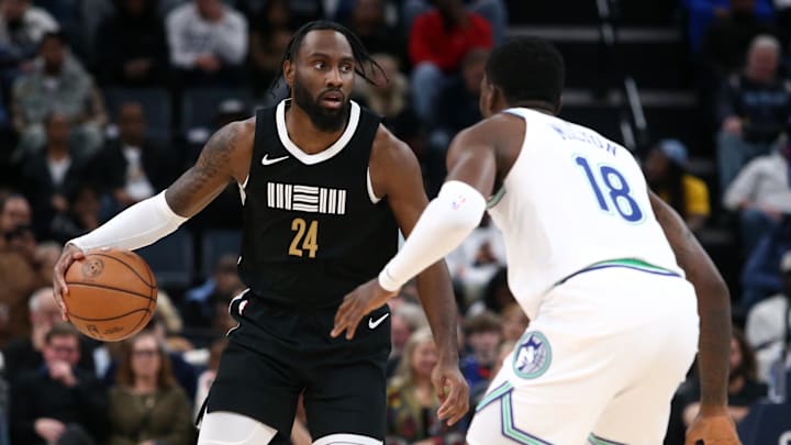 Dec 8, 2023; Memphis, Tennessee, USA; Memphis Grizzlies guard Jaylen Nowell (24) dribbles as Minnesota Timberwolves guard-forward Shake Milton (18) defends during the second half at FedExForum. Mandatory Credit: Petre Thomas-Imagn Images