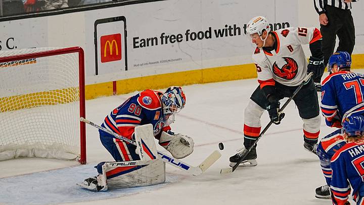 Coachella Valley Firebird John Hayden, 15, tries to get shot past Bakersfield goalie Matt Tomkins during the Firebirds loss to Bakersfield at Acrisure Arena in Palm Desert, Calif., Dec. 19, 2025.