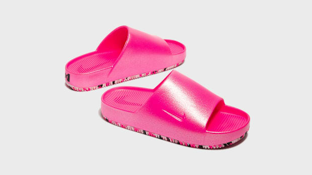 Pink Nike slides.